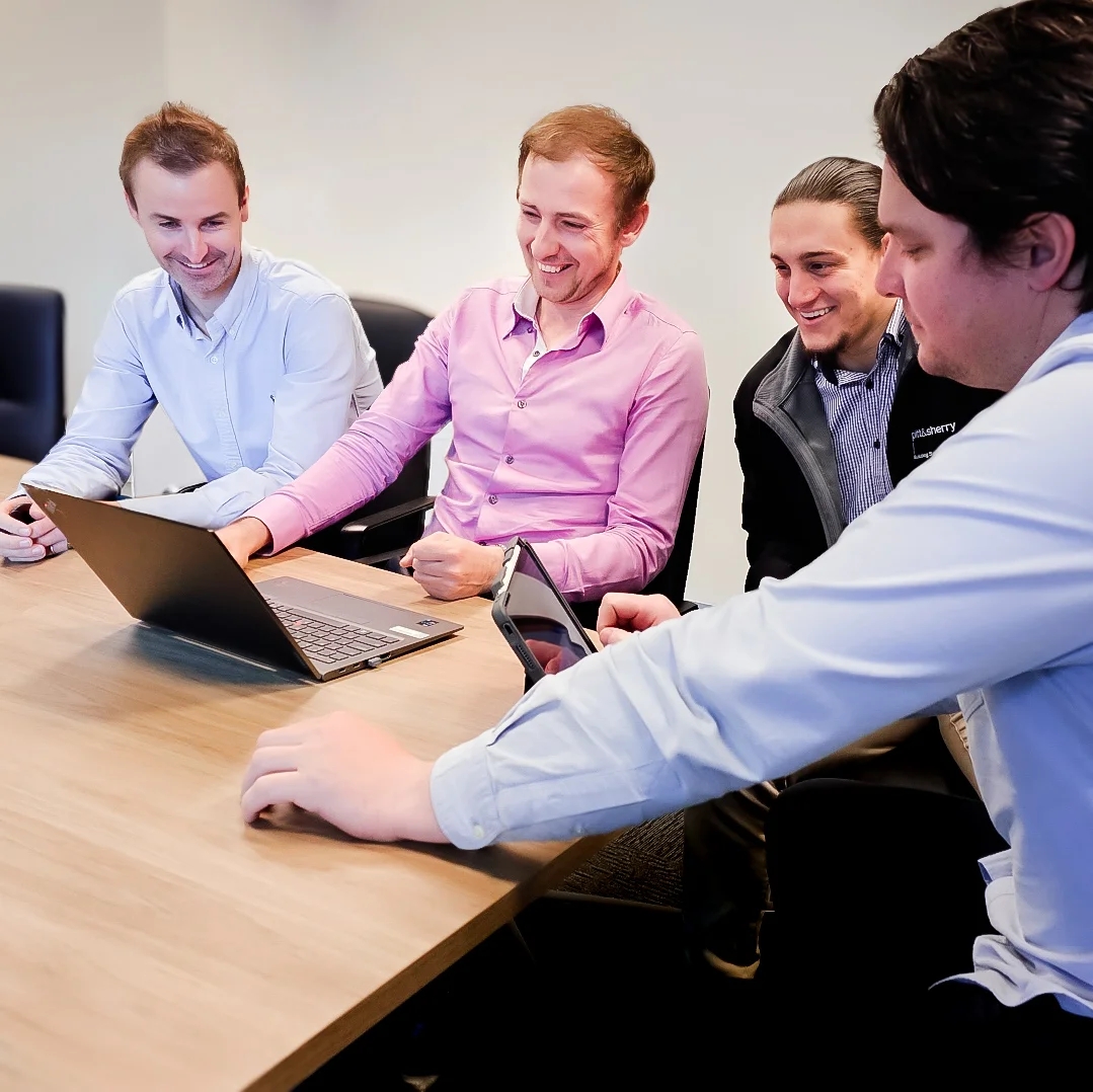 Team of consultants working at shared desk