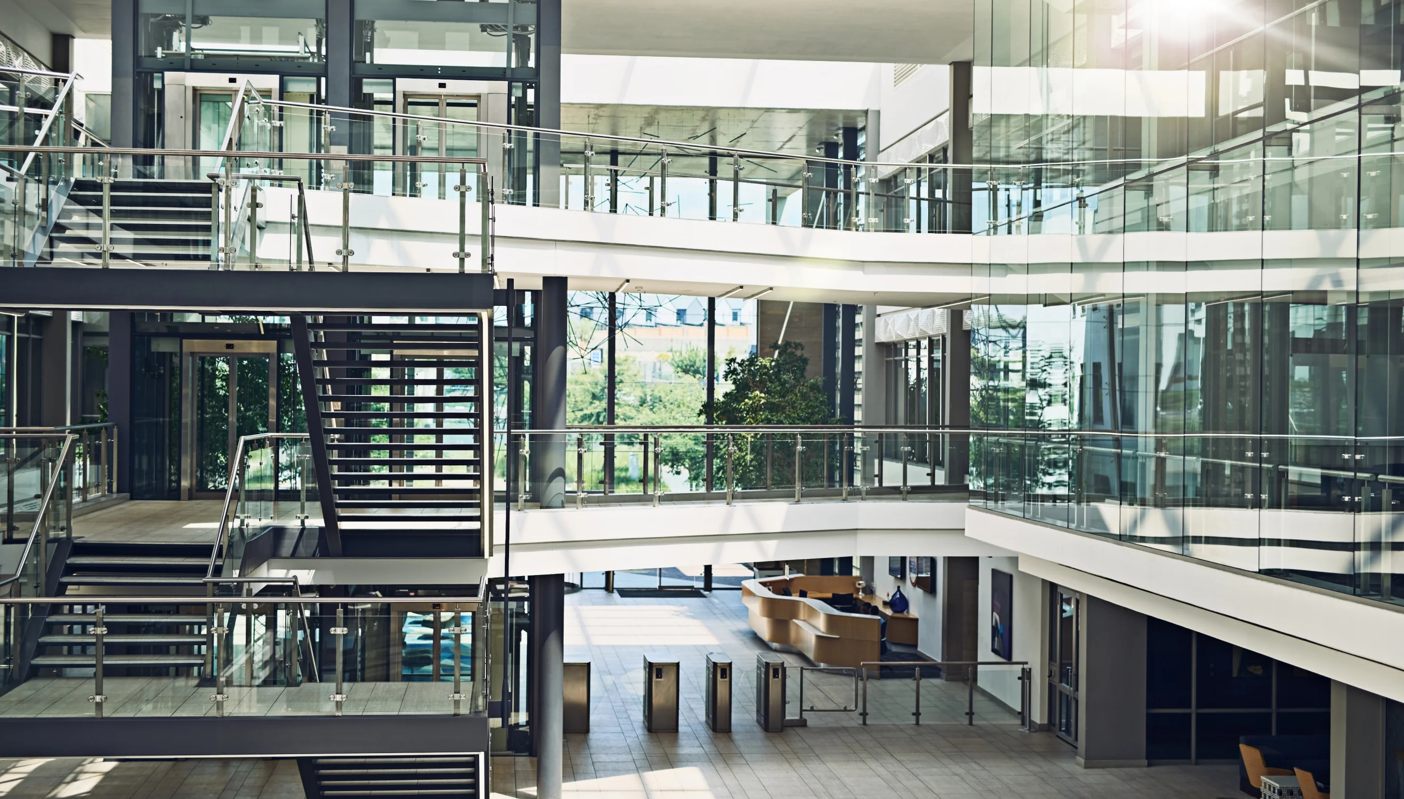 Internal multilevel view of glass building with staircase