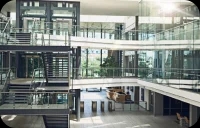 Internal view of multilevel glass building with staircase