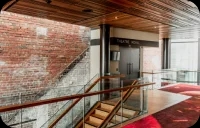 Internal view of wooden staircase inside brick building